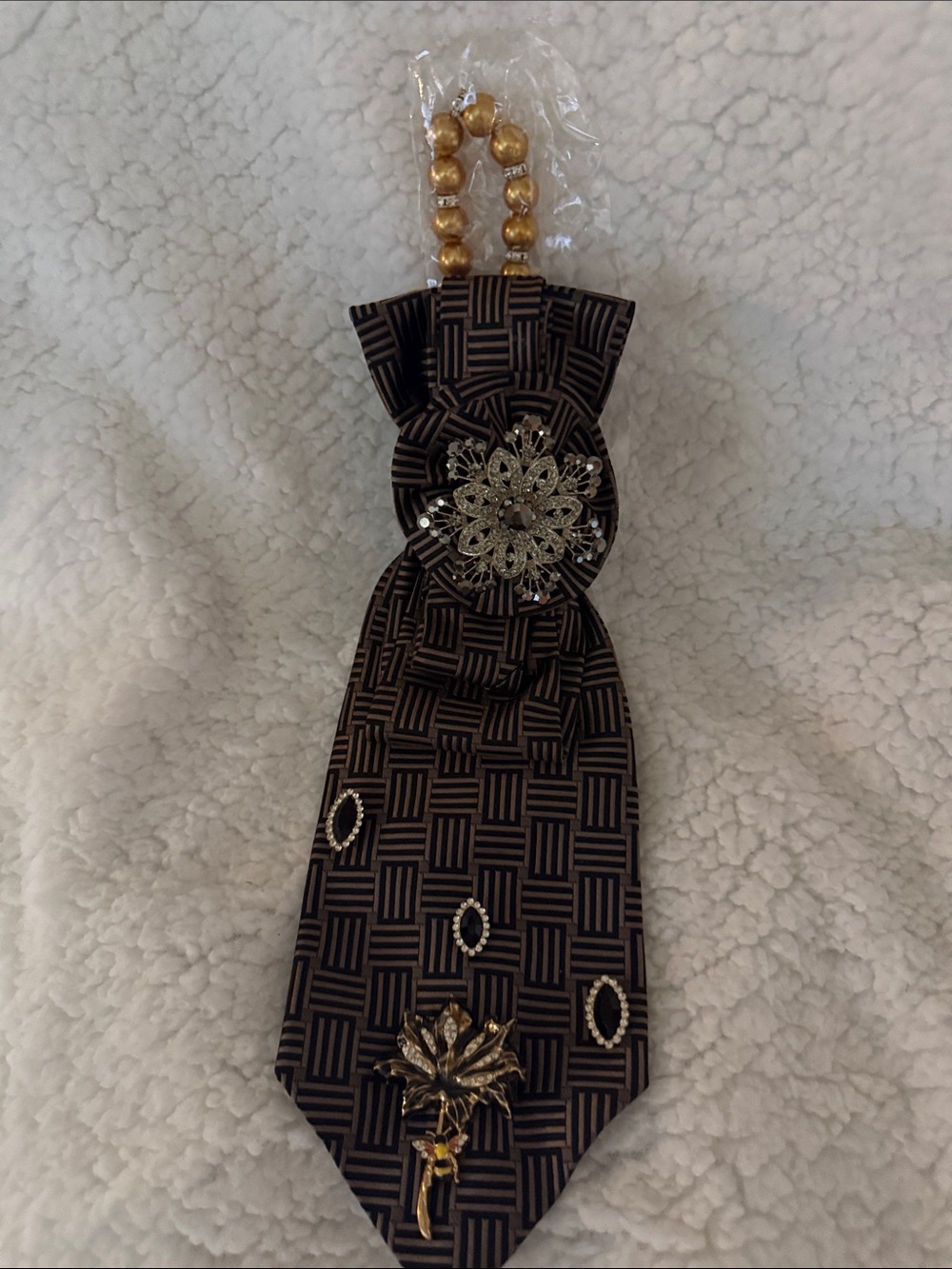 Gold and Black Patterned Pendant Necklace with Decorative Brooch Accents